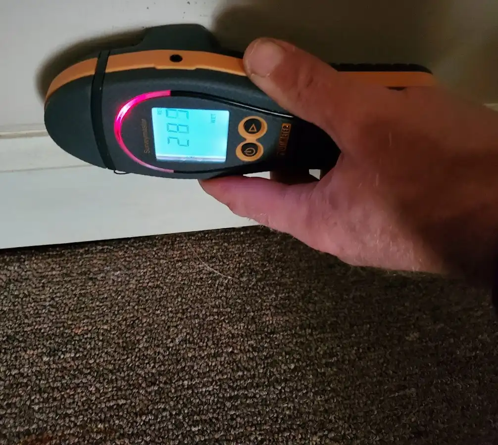 Moisture detection at baseboard during Storm Damage Restoration in Newberg